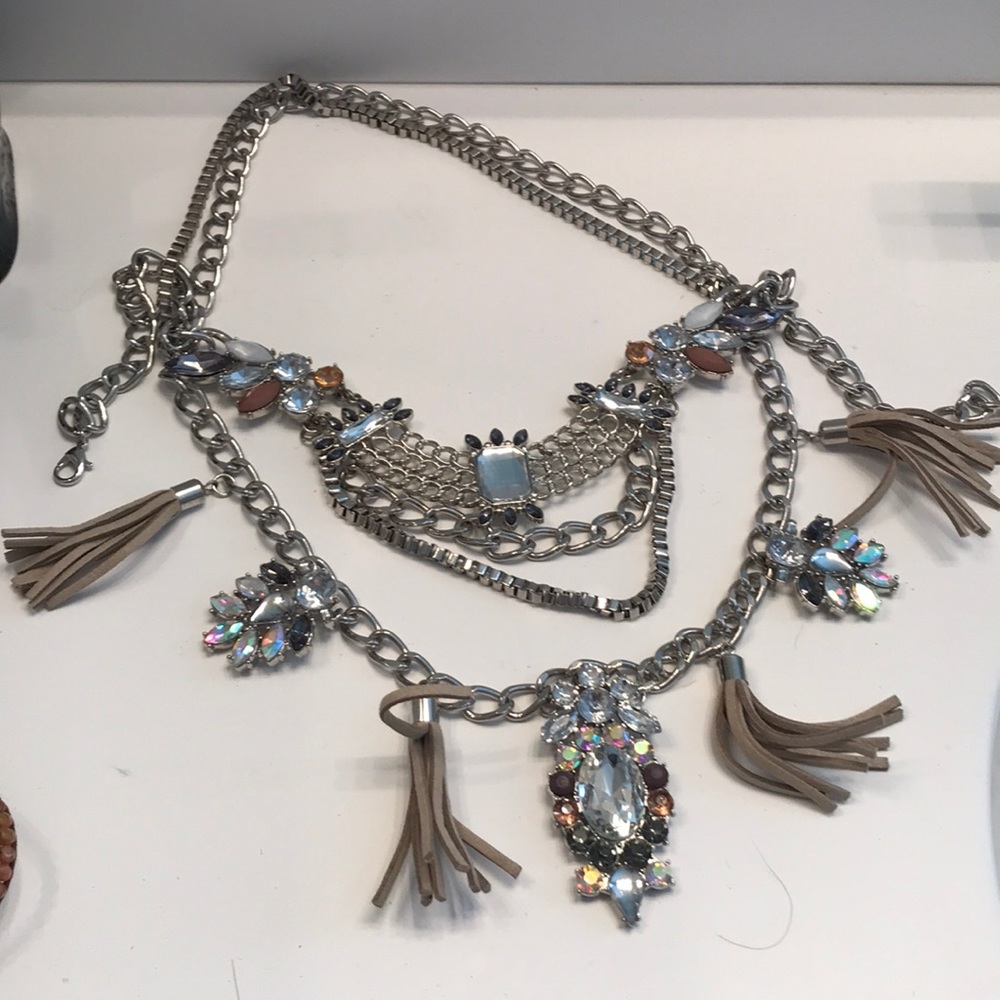 Costume jewelry- 4 chained with beige tassels.
